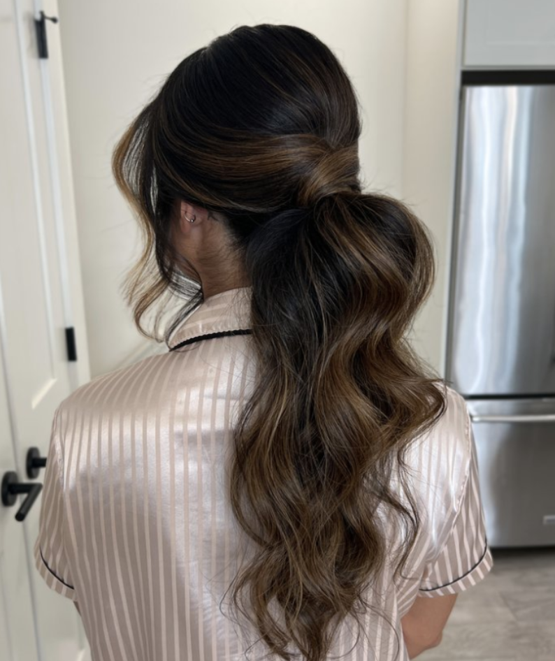 Sleek and stylish ponytail hairstyle expertly crafted by Erika Taft Bridal, offering a modern and sophisticated look for the fashion-forward bride.