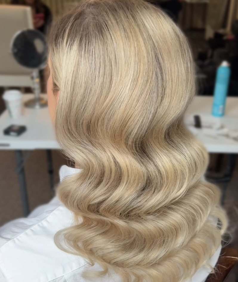 Captivating image showcasing long Hollywood waves styled by Erika Taft Bridal, exuding timeless glamour and sophistication for any bridal occasion.