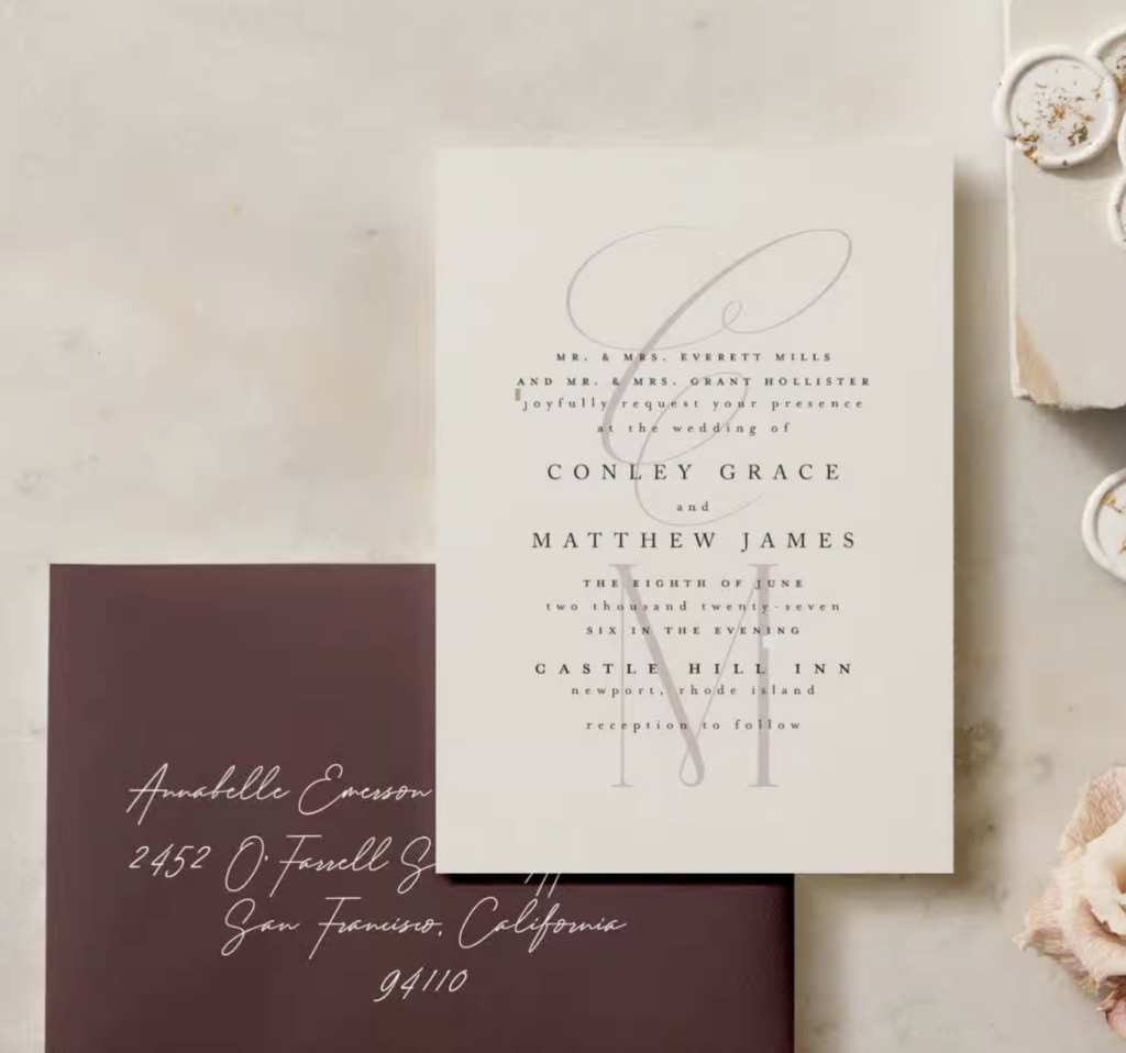 A wedding invitation with an addressed envelope. The invitation features elegant design elements and details, while the envelope is neatly addressed with calligraphy, adding a personalized touch to the anticipation of the special event